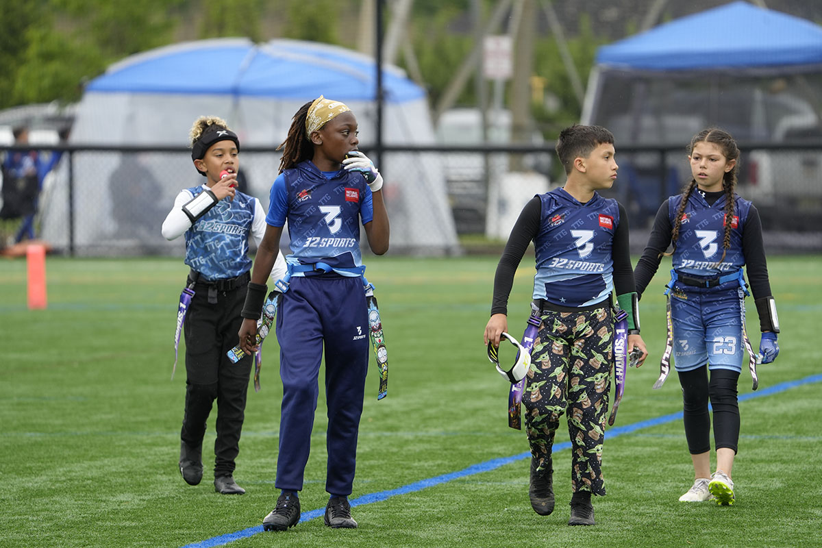 Connecticut 32 Sports teammates walking together on the flag football field