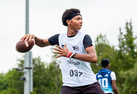 A quarterback throwing during a 32 Sports Prep School Showcase